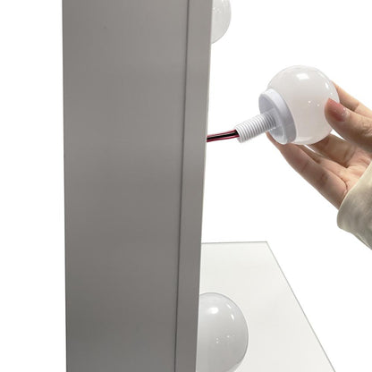 Tocador Aura blanco mate con luces LED y silla con cojín - detalle de acabado
